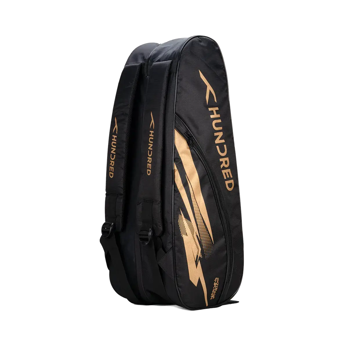 HUNDRED Cosmogear Kit Bag in black with gold accents, featuring a racket-shaped profile and padded backpack straps