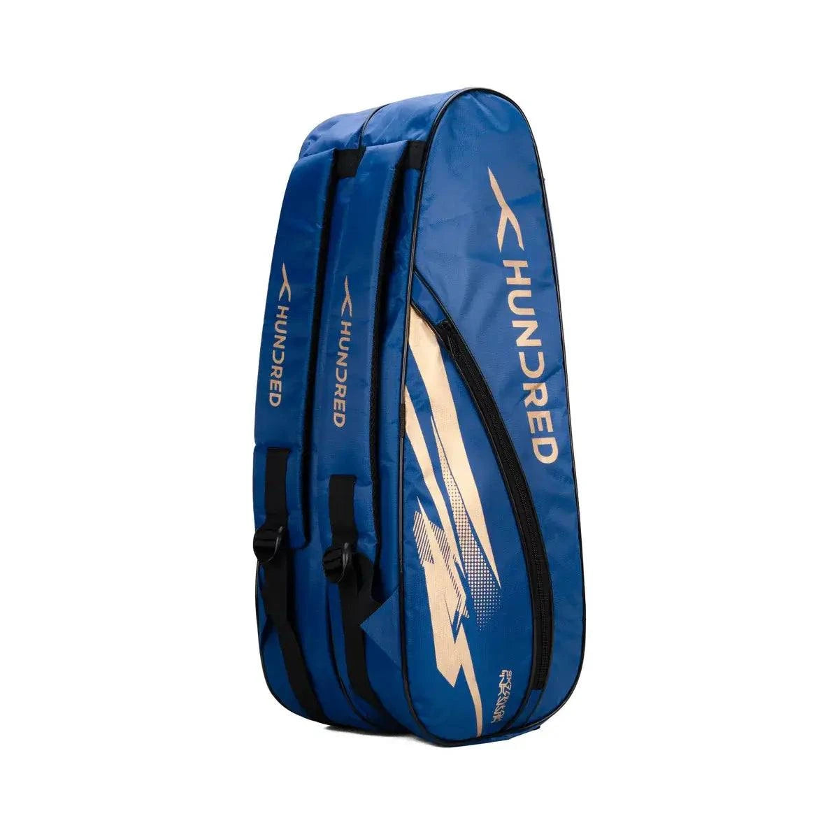 HUNDRED Cosmogear Kit Bag in blue with gold graphic accents, black trim, zip compartments and padded straps