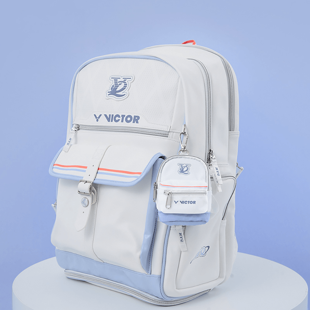 Victor HYQ backpack in bright white PU composite and polyester with pale blue trim, red accents, and a mini pouch