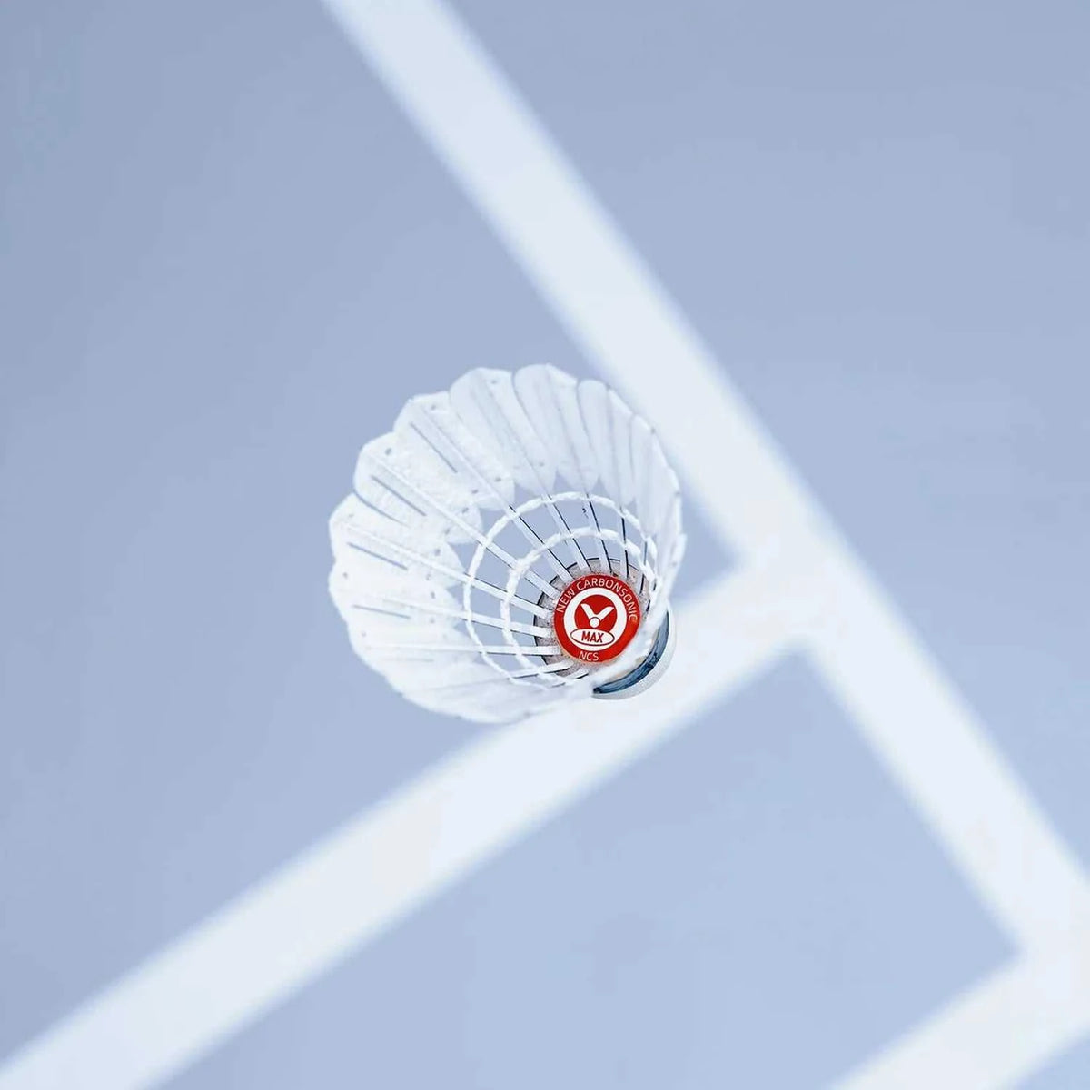 Victor New CarbonSonic Max synthetic shuttlecock with white aerodynamic feathers, a composite cork head and red marking