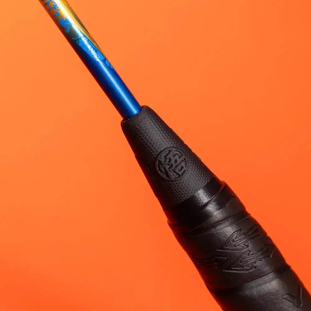 Victor x Dragon Ball Z badminton racket with a metallic blue and gold shaft, black textured grip and embossed logo details