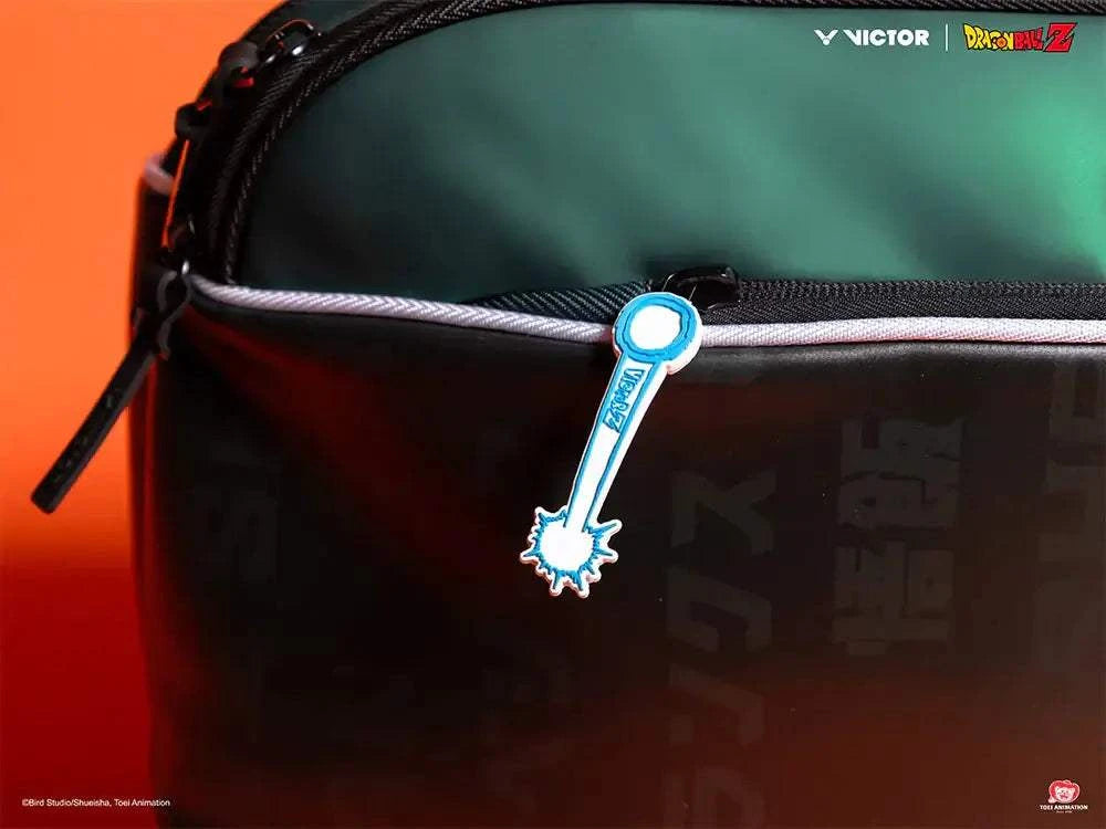 Rectangular racket bag in deep teal and black with a Dragon Ball Z graphic, white piping and blue zipper pull; Victor x Dragon Ball Z