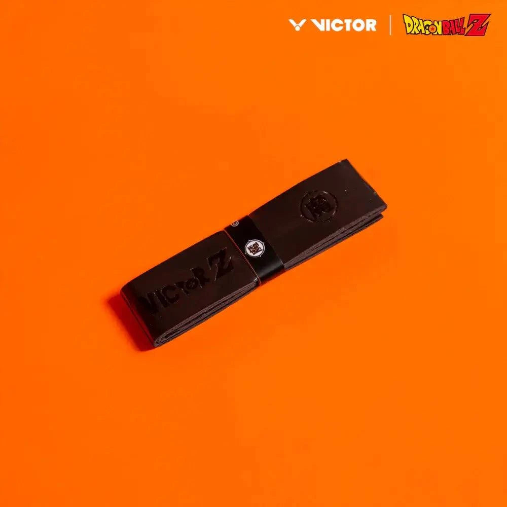 Victor x Dragon Ball Z Grip in black polyurethane with embossed branding and a small character emblem
