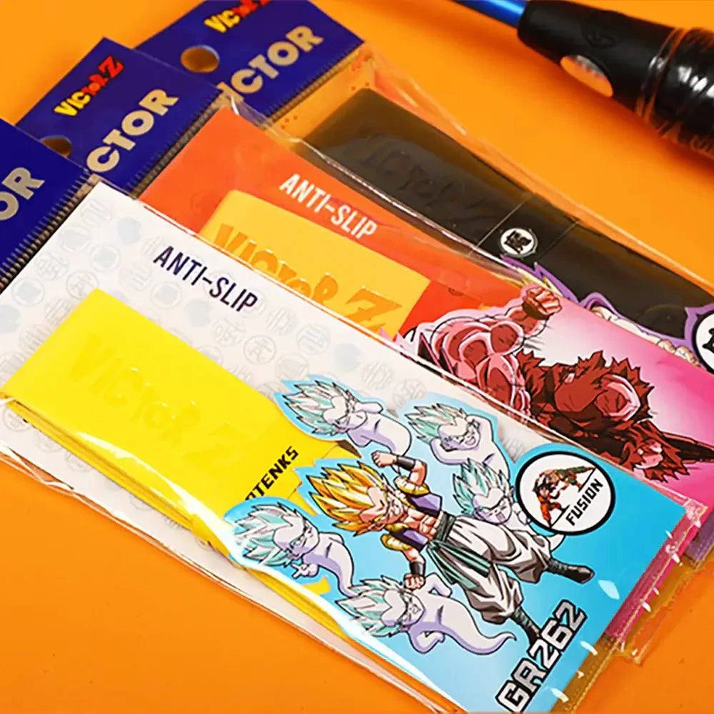 Victor x Dragon Ball Z Grip badminton overgrips in neon yellow, orange and black, with Dragon Ball Z character graphics and anti-slip packaging