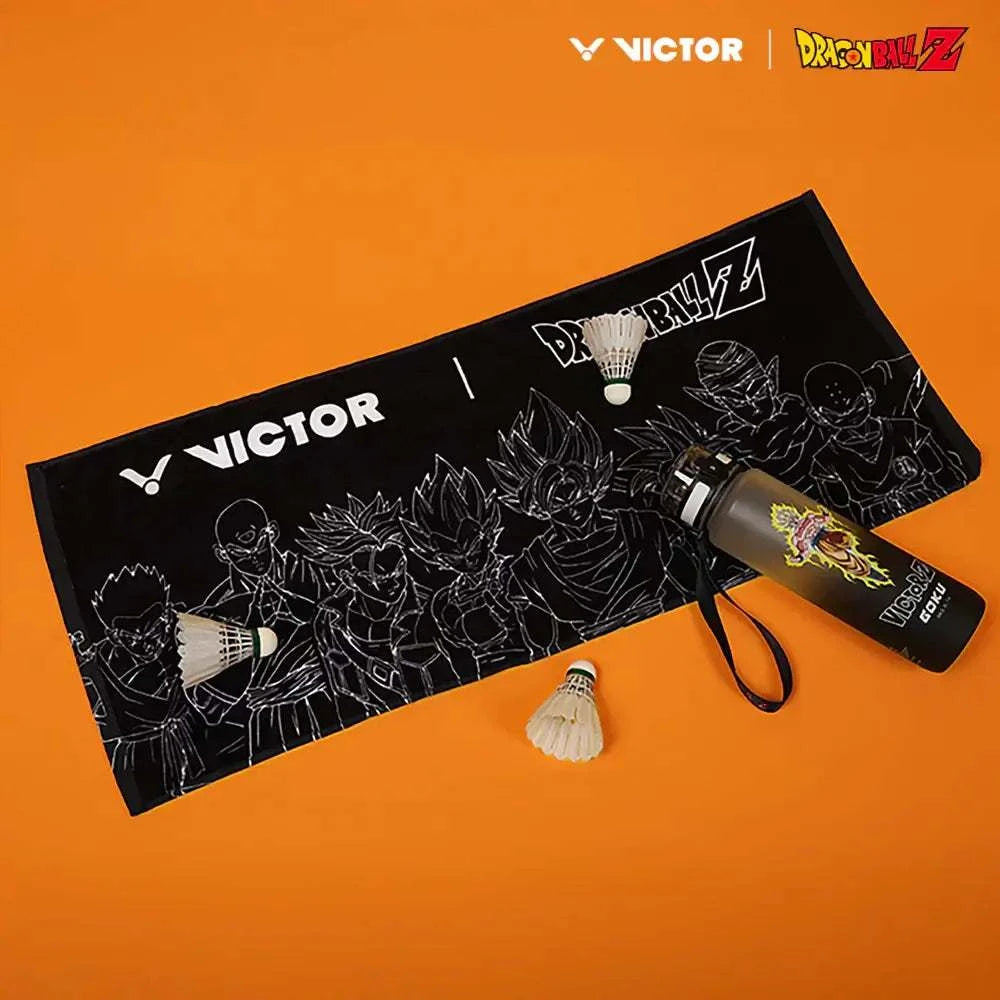 Victor x Dragon Ball Z Towel in black cotton, featuring white character line art and Victor and Dragon Ball Z logos