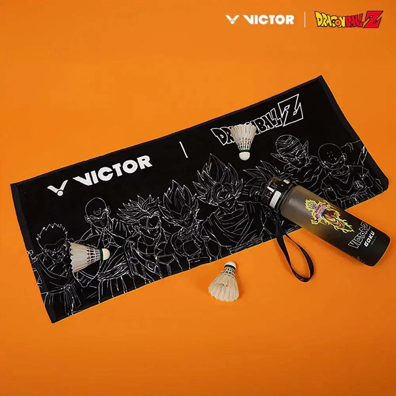Victor x Dragon Ball Z Towel in black cotton, featuring white character line art and Victor and Dragon Ball Z logos