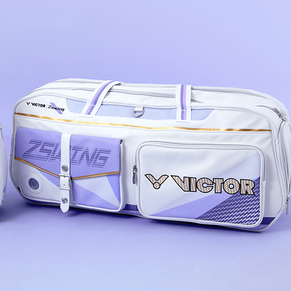 Victor ZSW racket bag in white with lavender panels, gold trim, rectangular shape, and prominent Victor and ZSW logos