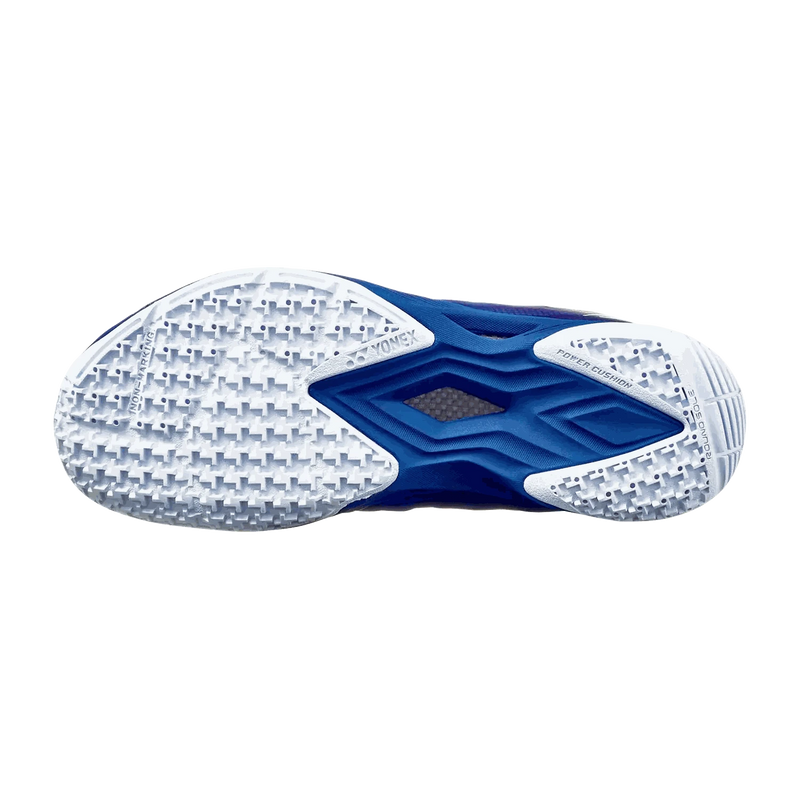 Yonex Aerus Z2 LX badminton shoe outsole in navy blue and white, with a textured radial traction pattern and midfoot support plate