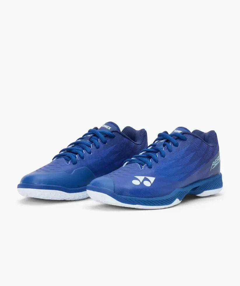 Yonex Aerus Z2 badminton shoes in navy blue, with mesh uppers, blue laces, white Yonex logos and textured soles