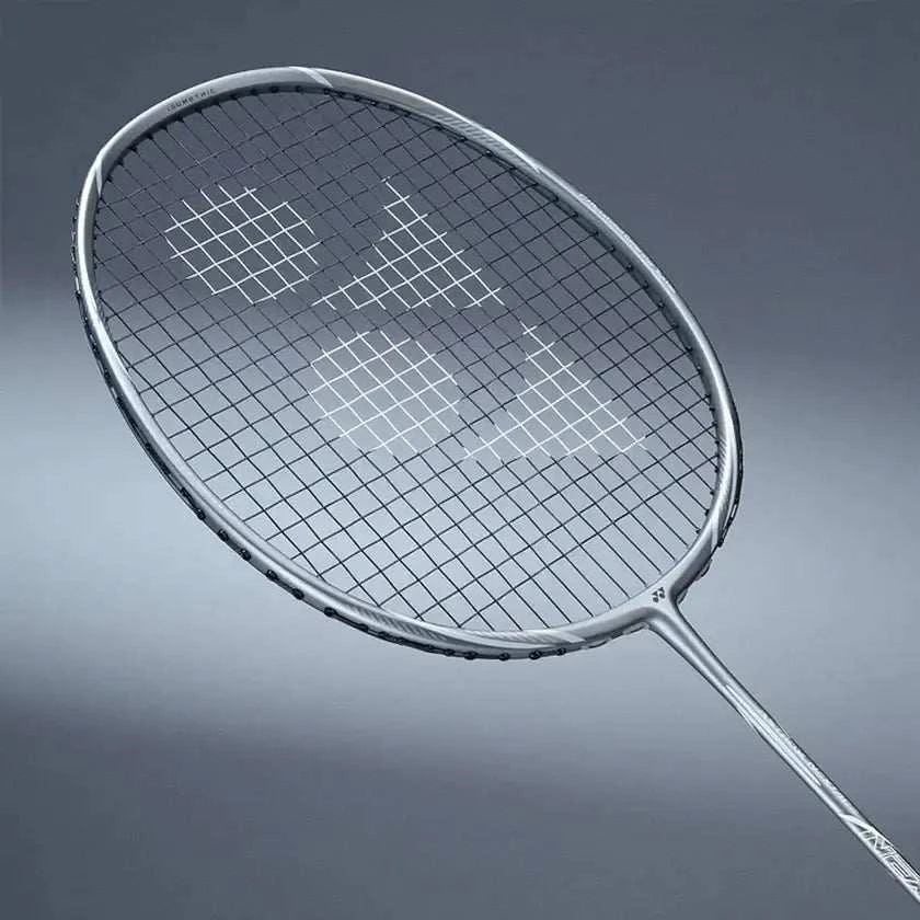 Yonex Astrox Nextage Badminton Racket with a silver-gray frame, dark crisscross strings and a slim shaft