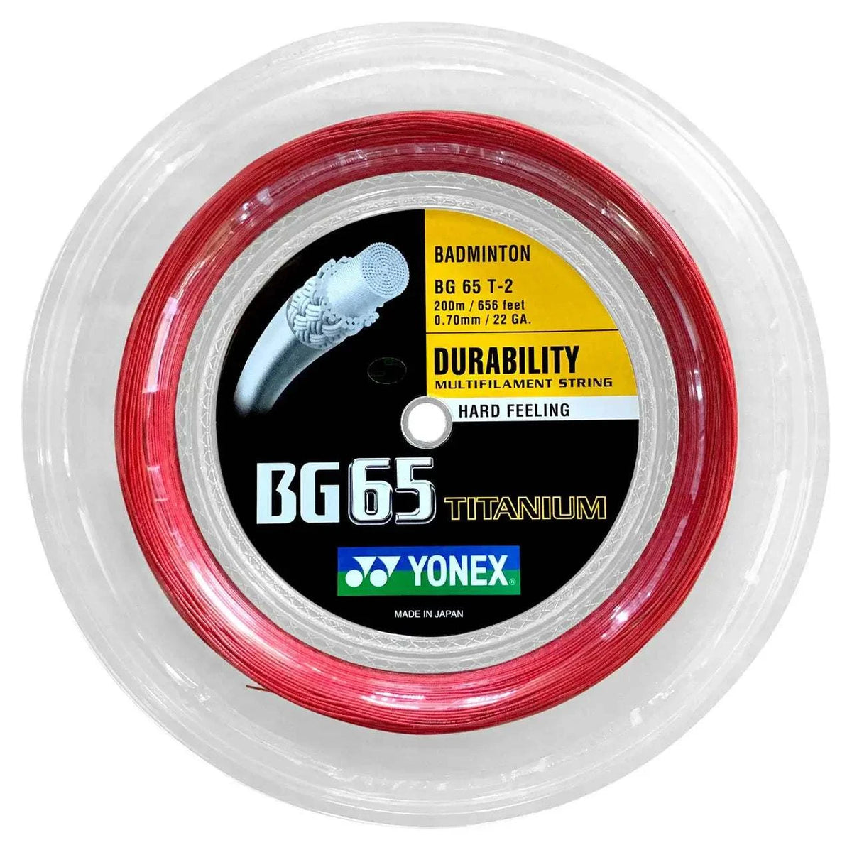 Yonex BG-65 TI badminton string in a red titanium-coated reel with clear casing and a black, yellow and green label