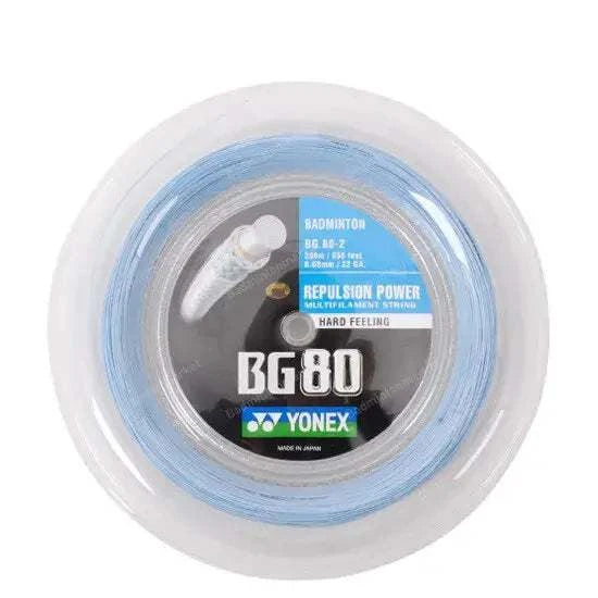 Yonex BG-80 Badminton String on a reel, with pale blue string and a black, blue and green Yonex label
