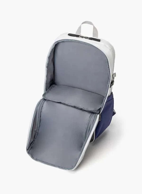 Yonex Club Series badminton backpack in white and navy with a grey-lined main compartment opened to show its interior