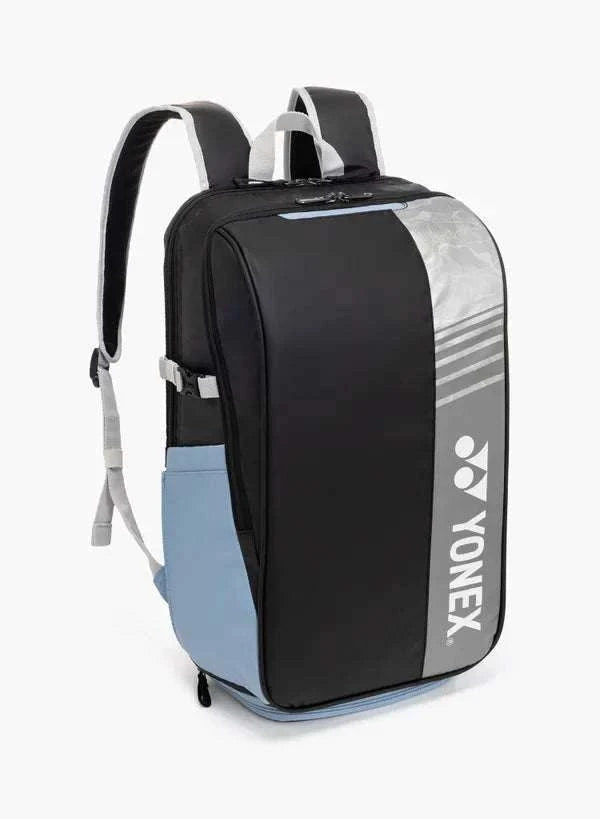 Yonex Club Series badminton backpack in black and light blue with a silver striped Yonex logo panel and padded straps