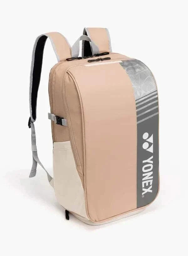 Yonex Club Series badminton backpack in blush pink with a grey Yonex logo panel, cream side pocket and padded straps