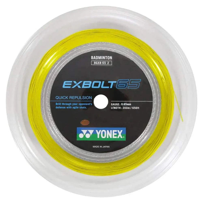 Yonex Exbolt 65 Badminton String in a vivid yellow 200-metre reel, with a round spool and branded centre label.