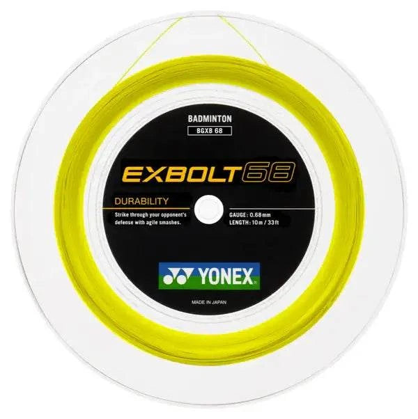 Yonex Exbolt 68 badminton string reel in bright yellow, tightly wound around a white spool with a black center label