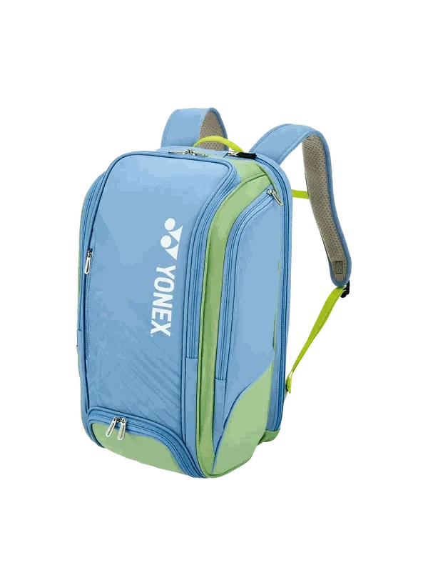 Badminton backpack in light blue with lime green panels, white Yonex branding, multiple zippered compartments and padded straps