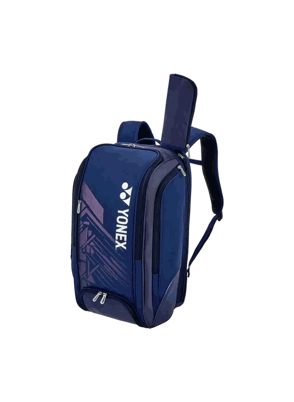 Yonex Expert Series badminton backpack in navy blue with purple geometric panel, white logo, padded straps and racket compartment