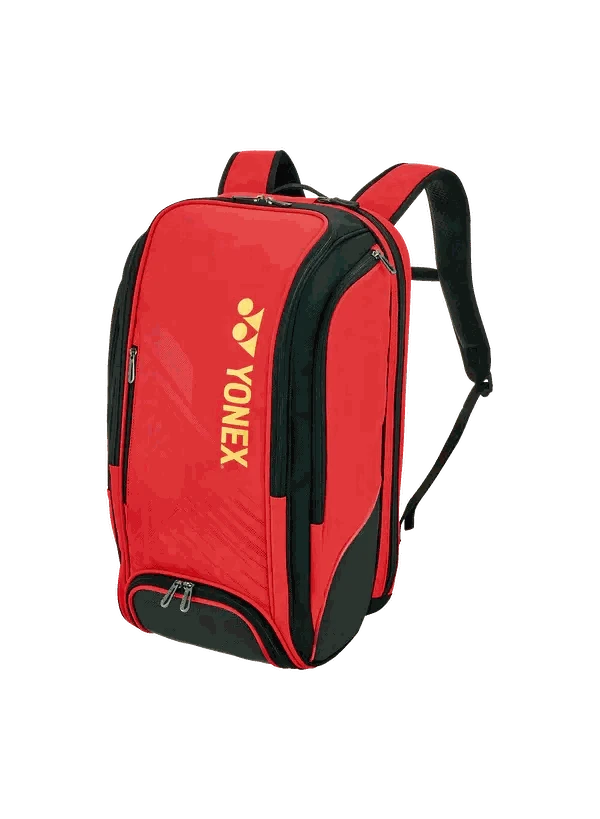 Yonex Expert Series badminton backpack in bright red with black trim, yellow logo, zip compartments and padded straps