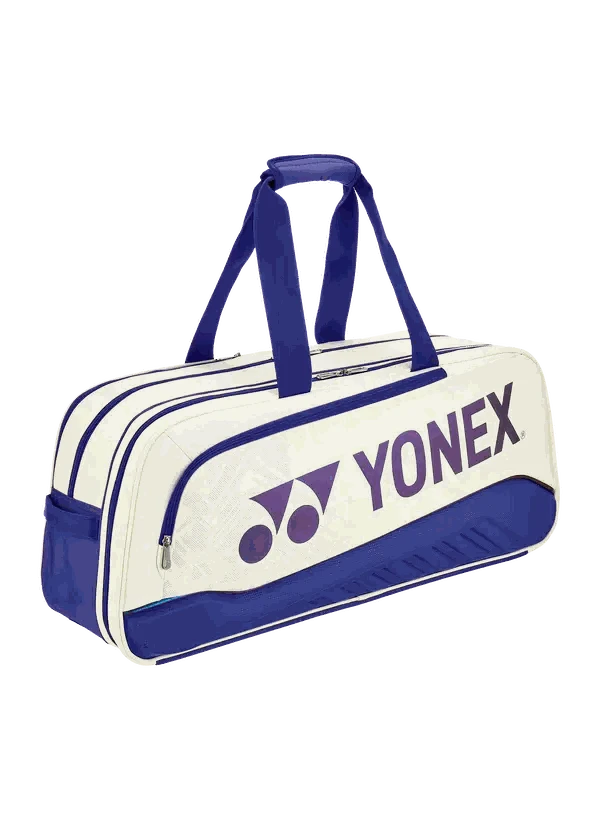 Yonex Expert Series Tournament Badminton Bag in cream and navy with purple logo, zip compartments and shoulder straps