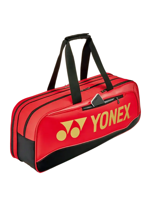 Yonex Expert Series Tournament Badminton Bag in bright red with black trim, bold yellow logo and twin carry handles