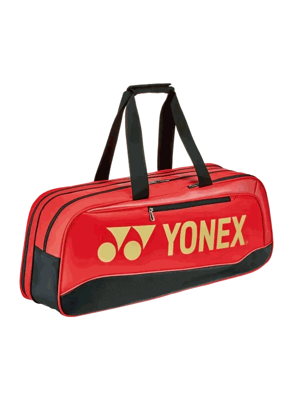 Yonex Expert Series Tournament Badminton Bag in bright red with black trim, bold yellow Yonex logo and dual handles