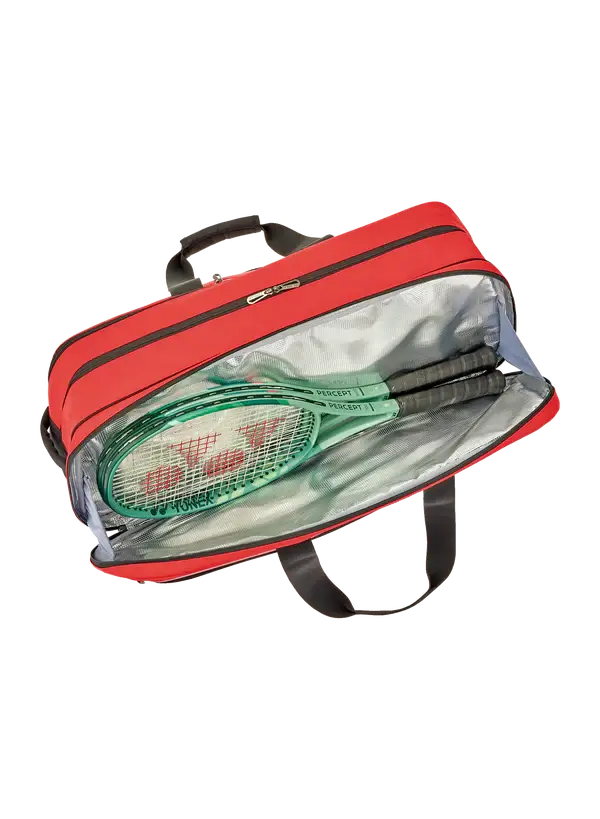 Yonex Expert Series Tournament Badminton Bag in red with black trim, open to show a silver lining and stored rackets