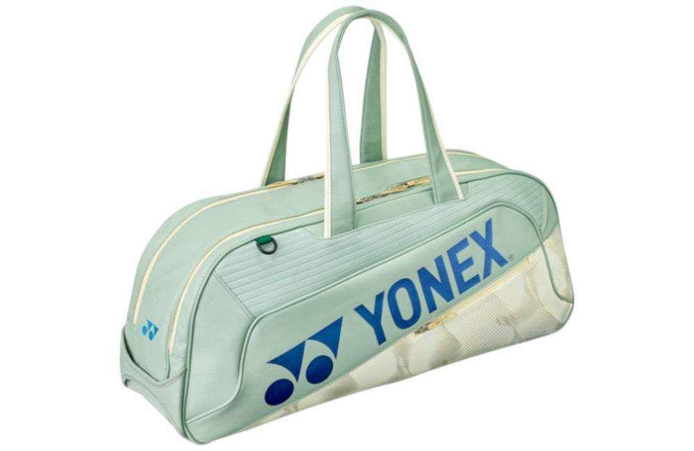 Yonex Expert Series Tournament badminton bag in pale mint green with blue Yonex branding, cream trim, and twin carry handles