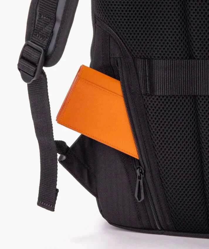 Yonex GEARLOGIC Backpack with black mesh padding, adjustable shoulder strap, zip pocket and orange accent panel