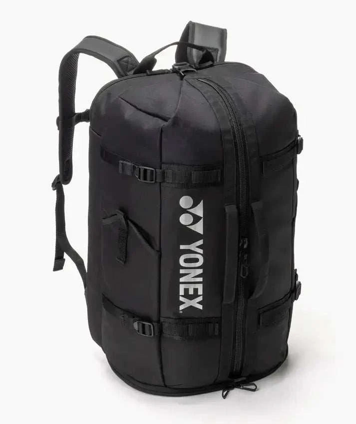 Yonex GEARLOGIC Backpack in black fabric with a structured shape, front compression straps, and prominent white logo