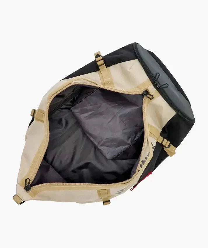 Yonex GEARLOGIC Backpack in cream and black with tan trim, shown open to reveal its spacious dark-lined main compartment