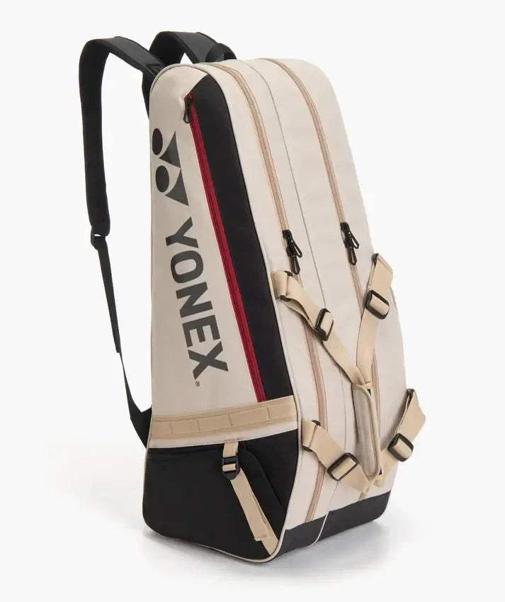 Yonex GEARLOGIC RACQUET BAG in cream with black base, red trim, bold logo and adjustable backpack straps