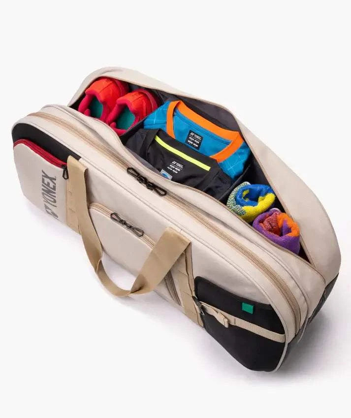 Yonex GEARLOGIC Tournament Bag in light beige with black trim, tan handles, zip pockets and colorful gear compartments