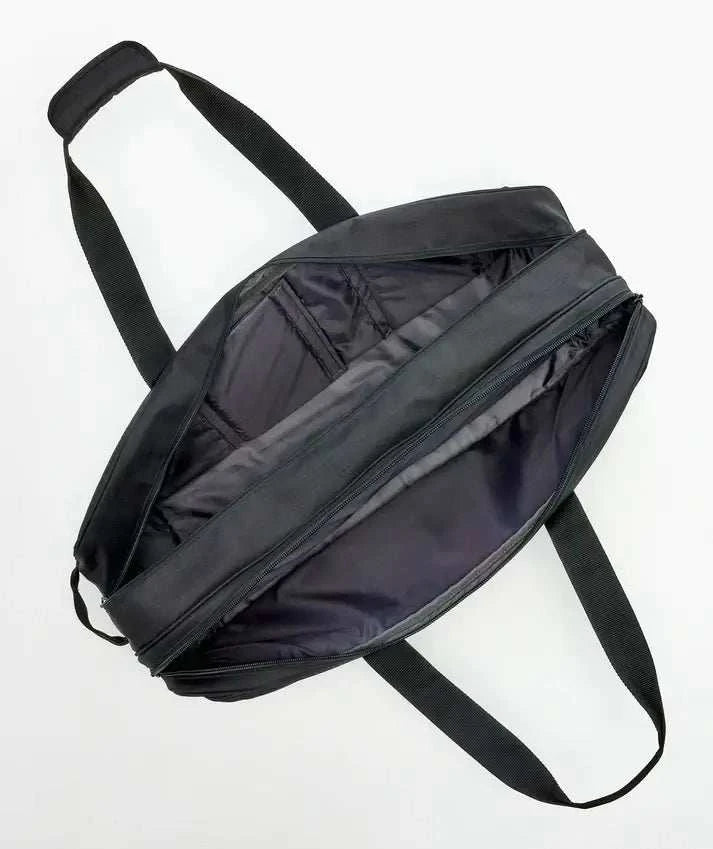 Yonex GEARLOGIC Tournament Bag in black, with a smooth synthetic exterior, padded shoulder straps, and zippered compartments.