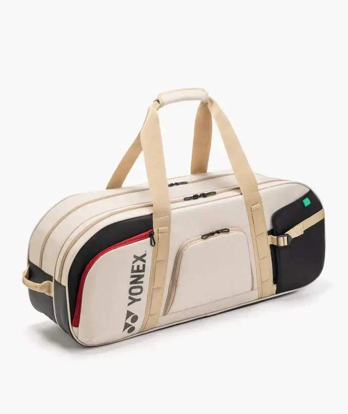 Yonex GEARLOGIC Tournament Bag in cream with black panels, red trim and beige straps, featuring zippered pockets