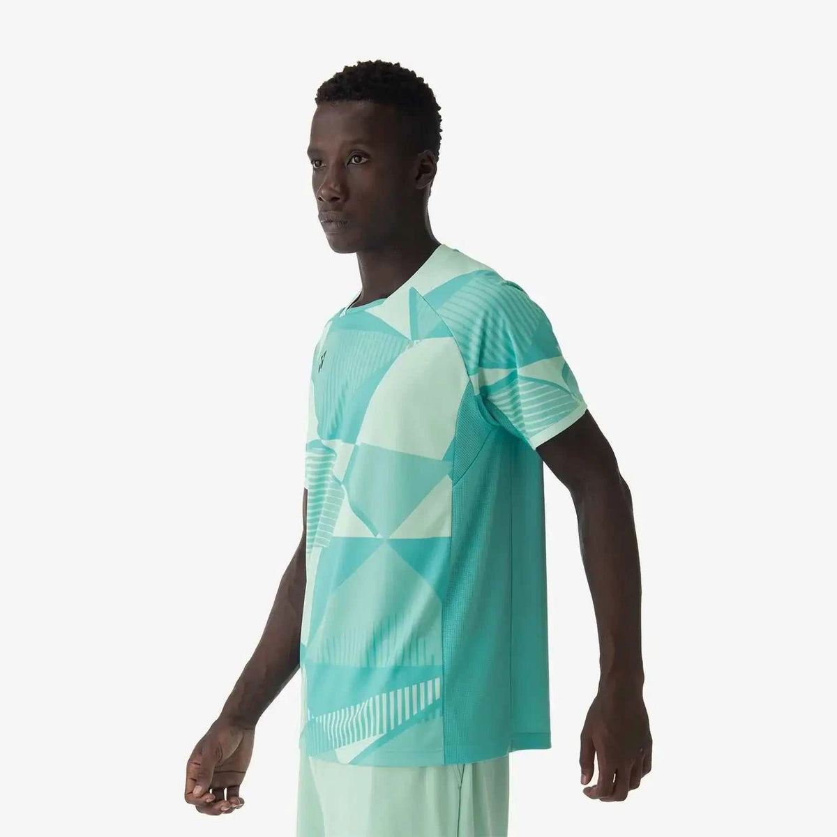 Yonex Men's Crew Neck performance shirt in clear mint polyester with geometric color-block panels and patterned short sleeves.