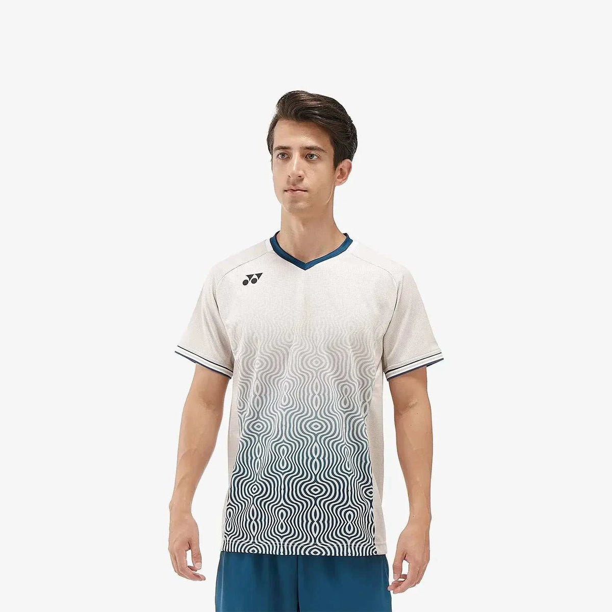 Yonex Men's Crew Neck Shirt in oatmeal with a dark teal geometric wave pattern fading up from the hem and contrast trim.