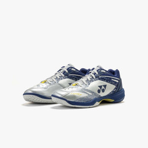 Yonex Power Cushion 65 Z4 badminton shoes in silver and navy, with mesh uppers, white laces and yellow accents