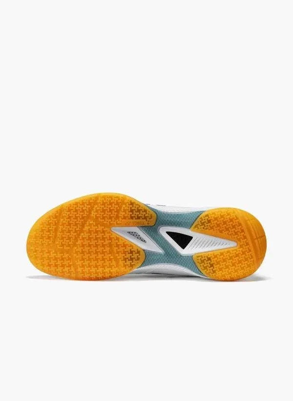Yonex Power Cushion 65 Z4 Slim badminton shoe with a white and grey sole, orange tread pods and a black midfoot insert