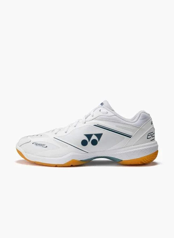 Yonex Power Cushion 65 Z4 Slim badminton shoe in white synthetic leather with navy accents and orange rubber outsole