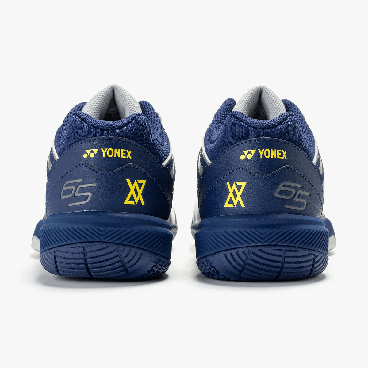 Yonex Power Cushion 65 Z4 Wide badminton shoes in navy blue synthetic leather with yellow logos and cushioned soles