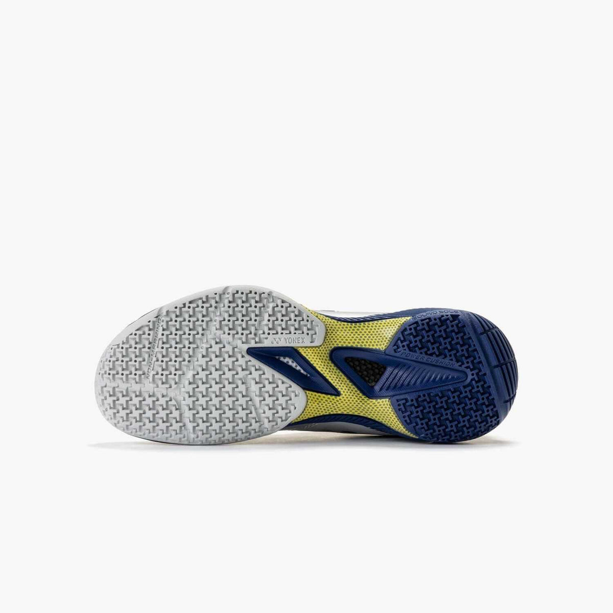 Yonex Power Cushion 65 Z4 Women's badminton shoe with a white and navy rubber outsole and lime green accents