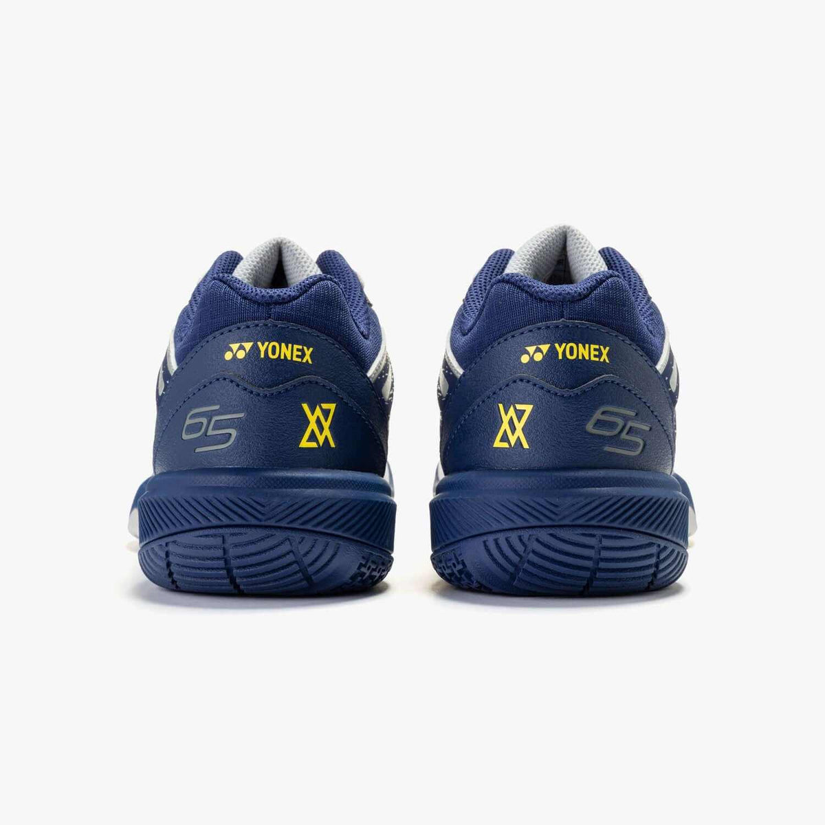 Yonex Power Cushion 65 Z4 Women's badminton shoes in navy and silver with yellow logos, cushioned heels and textured rubber soles