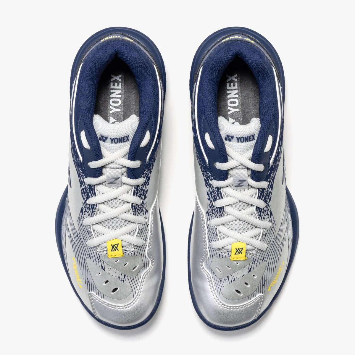 Yonex Power Cushion 65 Z4 Women's badminton shoes in silver and navy synthetic leather with mesh panels, white laces and yellow tags