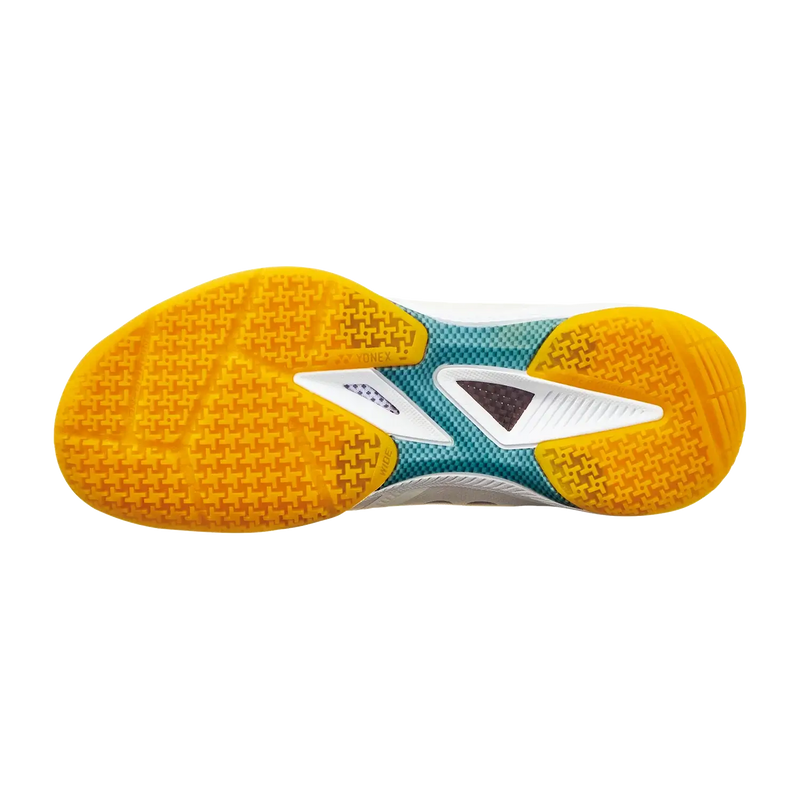 Yonex Power Cushion 65 Z4 badminton shoe outsole with bright yellow textured rubber tread and teal, white and gray sections