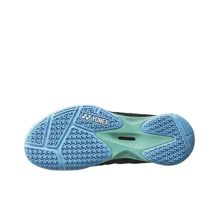 Yonex Power Cushion Comfort Z3 badminton shoe outsole in blue and mint, with a patterned rubber sole and central support plate