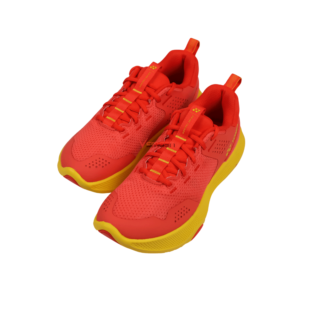 Yonex Prime Trainer Men shoes in bright red synthetic mesh with perforated panels, red laces and yellow rubber soles.