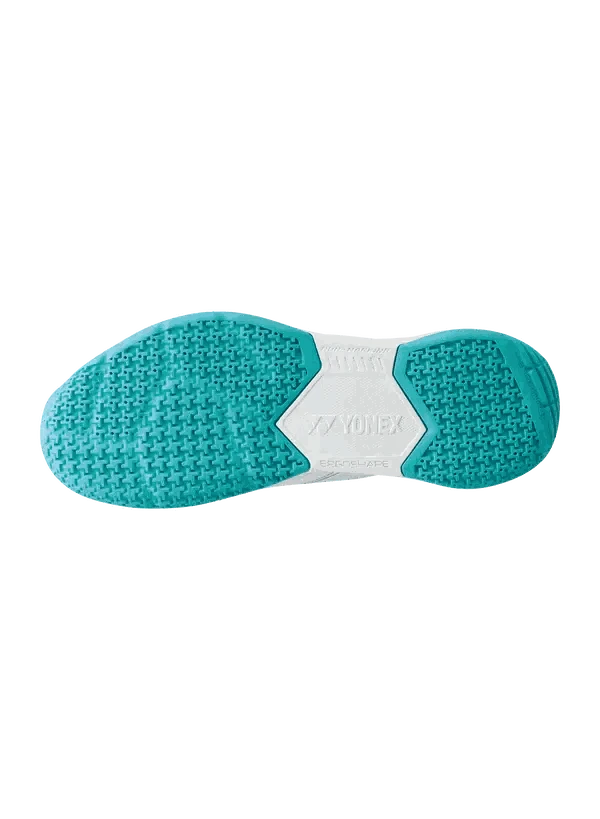 Yonex Strider Flow Power Cushion badminton shoe outsole in white and mint, with textured turquoise traction zones and a white center