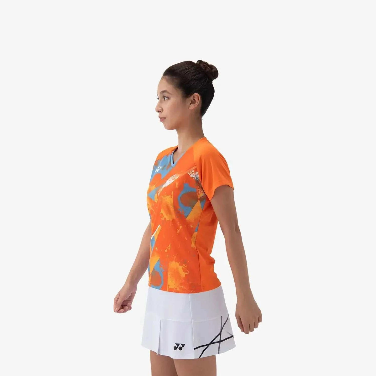 Yonex Women's Crew Neck Shirt in bright orange polyester with an abstract blue and orange print and short sleeves